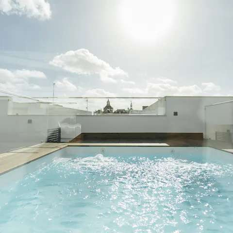 Relax in the rooftop swimming pool under the Spanish sun
