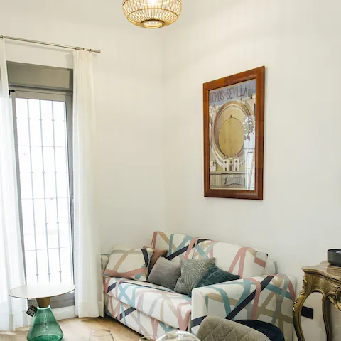 Stretch out in the living area after a day of roaming the streets of Seville 