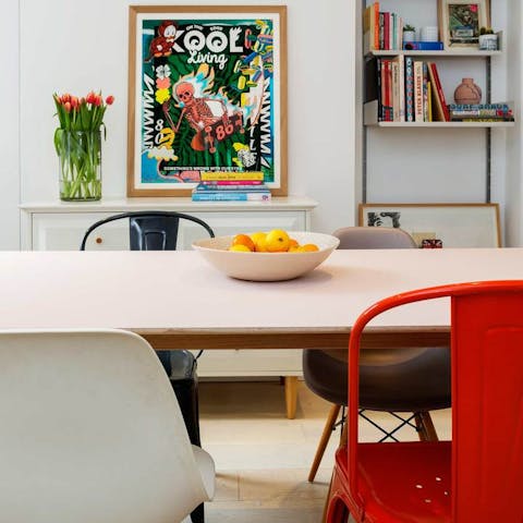 Gather around the dining table for some food and drink surrounded by colour