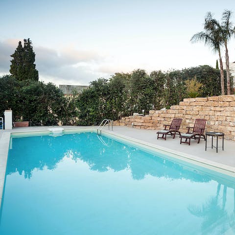 Take a dip in the glossy, aquamarine swimming pool