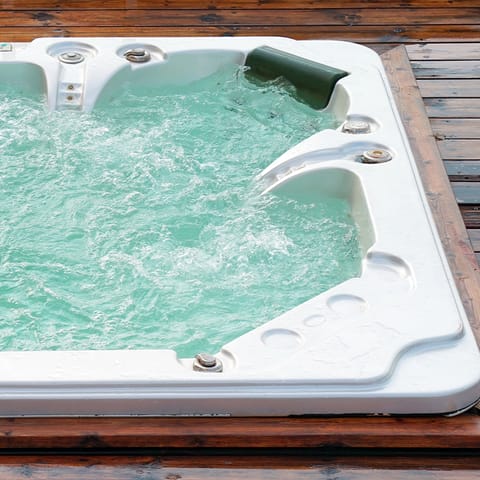 Soothe your tired muscles in the outdoor hot tub