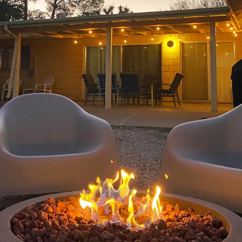 Share stories by the fire pit as the sun goes down
