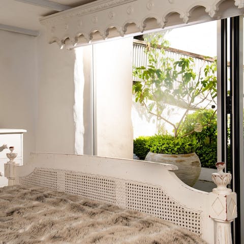 Wake up after a restful sleep and start the day by opening the patio doors to your lush garden