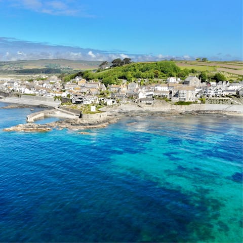 Spend your days swimming in the aqua blue seas of Marazion beach, just a ten-minute walk away