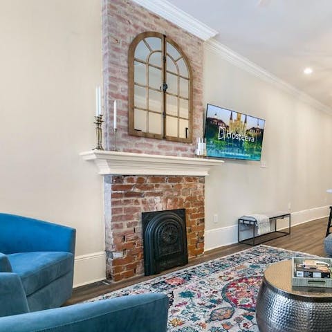 Enjoy typically New Orleans touches like the exposed brick fireplace