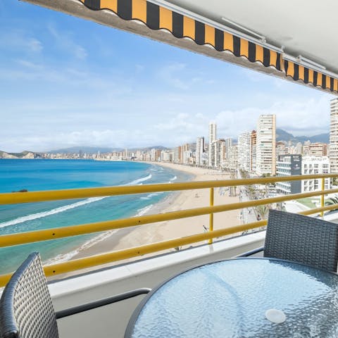 Sit out on the private balcony with gorgeous sea and beach views