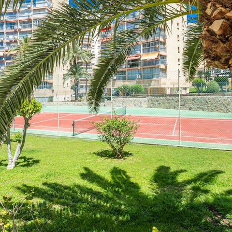 Stay active during your stay on the shared tennis court