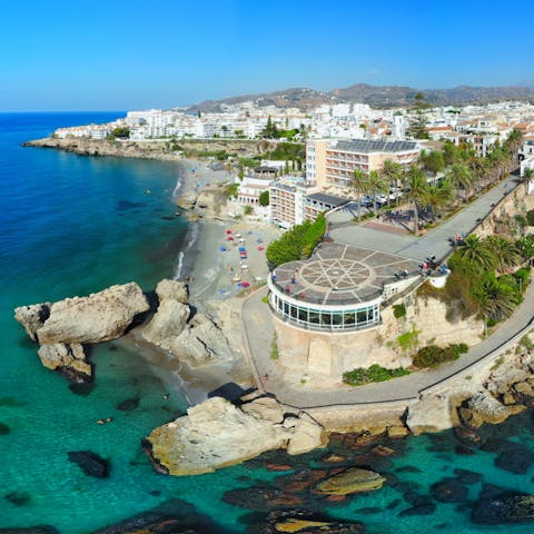 Admire the coastal vistas from the Balcón de Europa, a seven-minute drive away