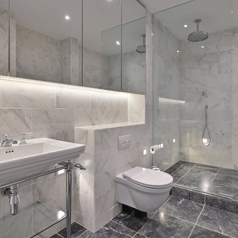 Freshen up in the marble bathroom's rainfall shower