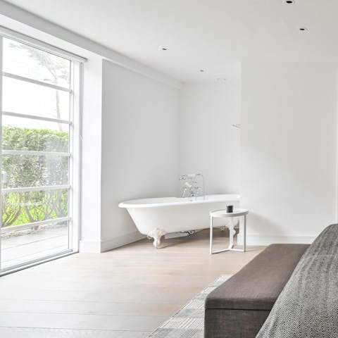 Indulge in a long soak in the master bedroom's in-room bathtub 