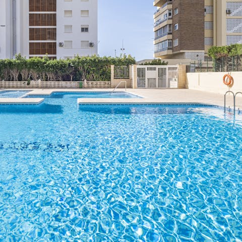 Take refreshing dips in the glistening pool, with a separate children's pool also available 