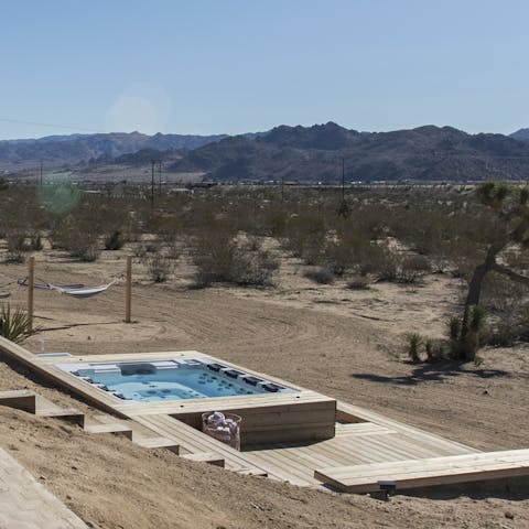 Admire the desert landscapes as you chill in the private hot tub