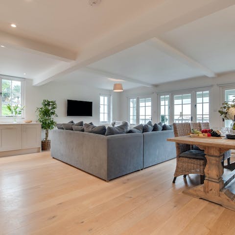 Socialise in the open-plan living area – complete with comfy sofa,  spacious dining area and a modern kitchen