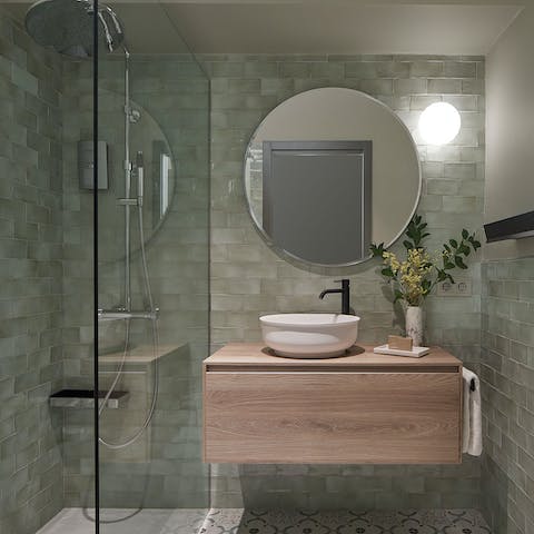 Start mornings with a relaxing soak under the large rainfall shower