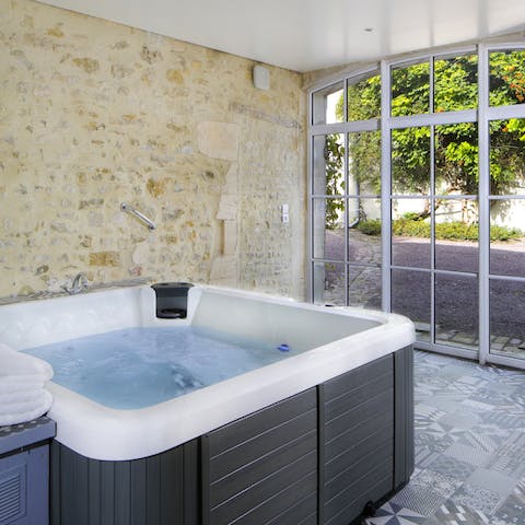 Soak in the jacuzzi and look out onto the garden