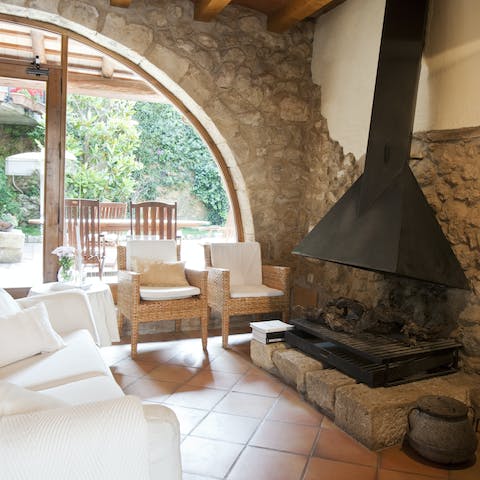 Gather around the old, traditional fireplace in one of the lounges