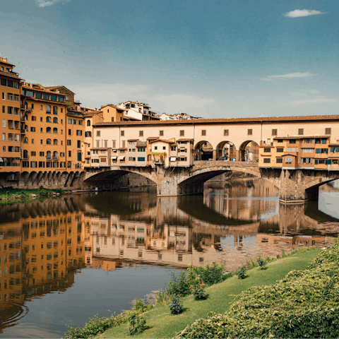 Stroll across famous Ponte Vecchio, two minutes away on foot