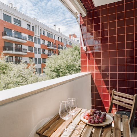 Toast the day's end with drinks on the cosy balcony