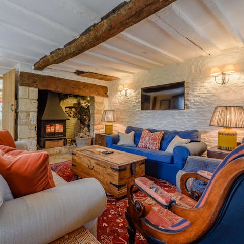 Relax in front of the fire in the cosy snug