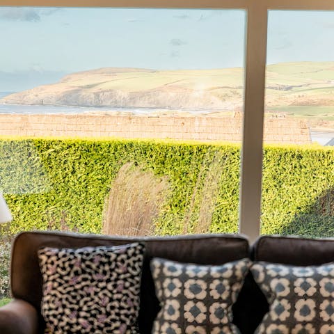 Admire the coastal views from the cosy living room