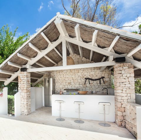 Embrace outdoor living with the full outdoor kitchen and bar
