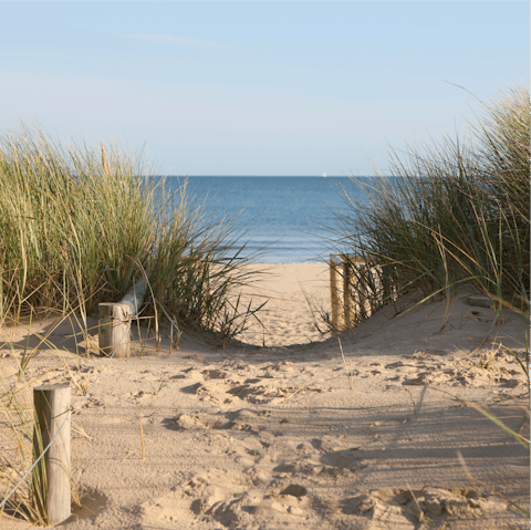 Sink your feet into the sand at Teignmouth beach, a short walk away