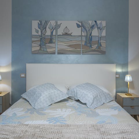 Admire art nouveau style paintings in themed bedrooms