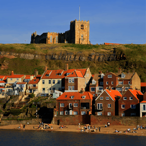 Sink your toes in the sand at scenic Whitby Beach