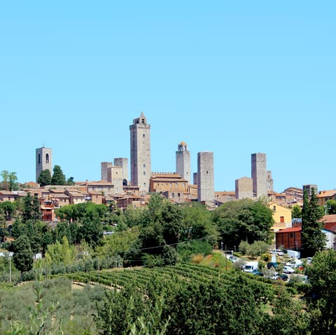 Eat gelato as you meander the narrow streets of historic San Gimignano – it's only 8km away