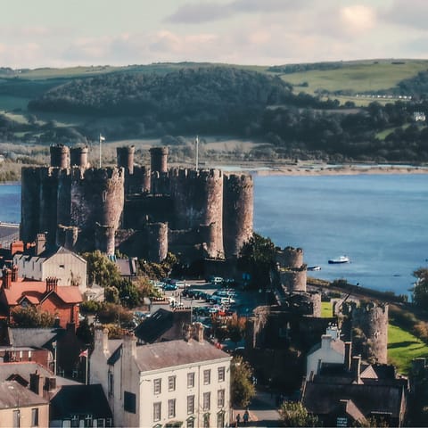 Explore Conwy, a historic town with medieval walls, a castle and pretty beaches