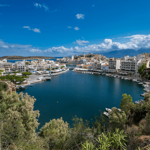 Grab a seat overlooking the lagoon in the charming coastal town of Agios Nikolaos, 26km away