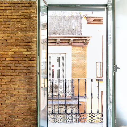 Look out over a traditional Madrid street from your private balcony