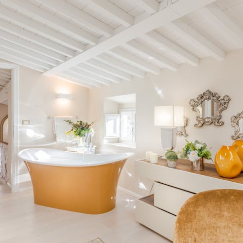 Soak in style in the stunning freestanding bath in the master bedroom