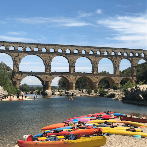 Rent a kayak and paddle under Vers-Pont-du-Gard, a short drive away