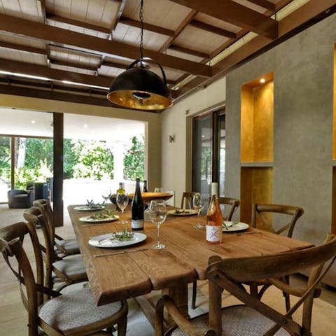 Tuck into alfresco family dinners in the privacy of your own villa