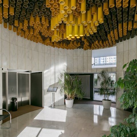Admire the modernist styling in the building's impressive lobby