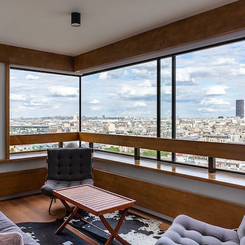 Gaze across the cityscape from your high-rise hideaway's living room