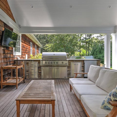 Fire up the grill in the outdoor kitchen