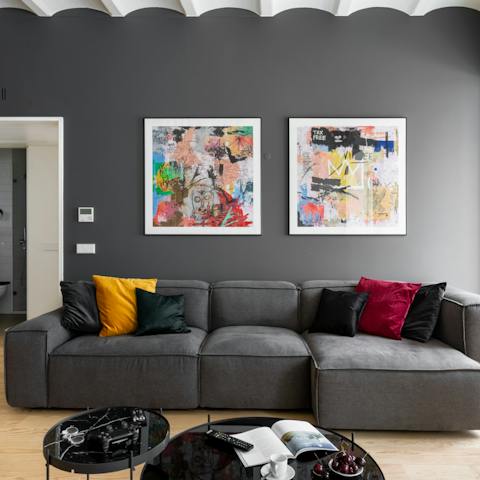 Recline on the modular sofa with a glass of Portuguese wine
