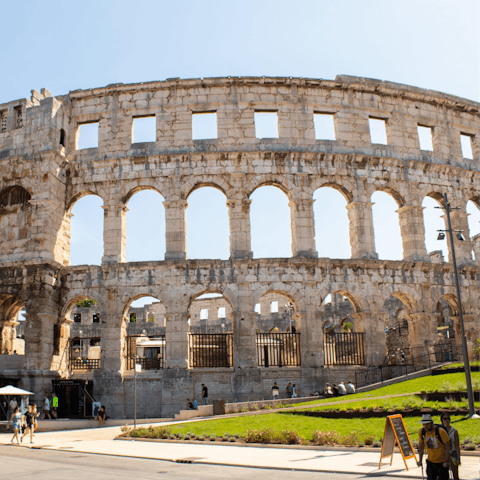 Head into the nearby city of Pula to visit its ancient arena built by the Romans