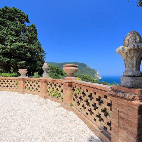Head off for a stroll around the shared gardens, taking in stunning cliff top views
