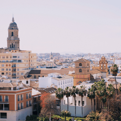 Plan a day trip to the coastal city of Malaga, only an hour's drive away