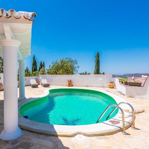 Slip into your swimwear and plunge into the villa's very own swimming pool