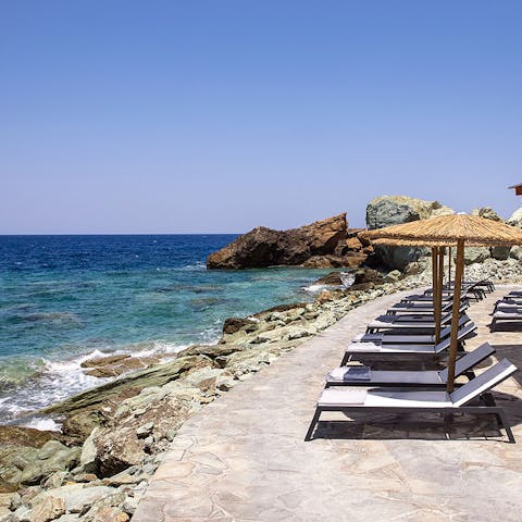 Enjoy private access to the sea and relax on the comfy sun loungers 