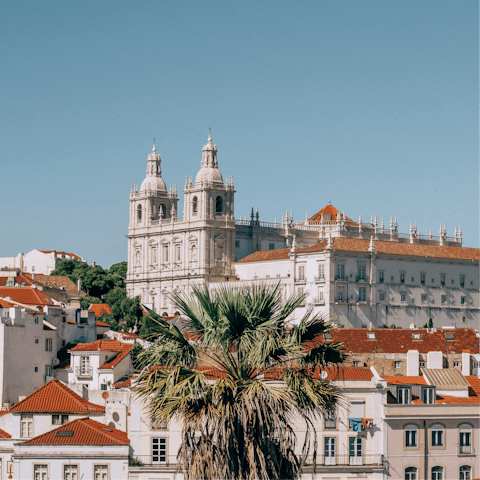 Explore the historic Alfama district and the São Jorge Castle, a thirteen-minute walk away