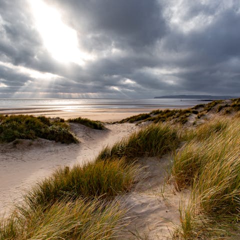 Enjoy afternoon strolls along the Camber Sands, a two-minute walk away