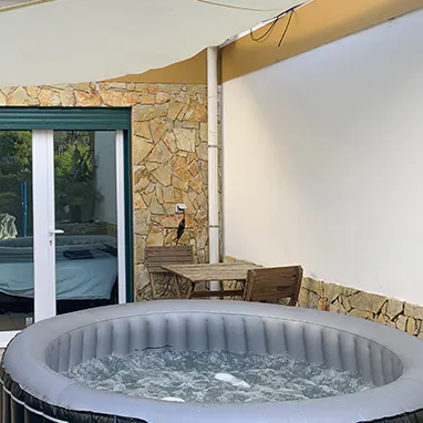 Enjoy a cool drink while soaking in the hot tub 
