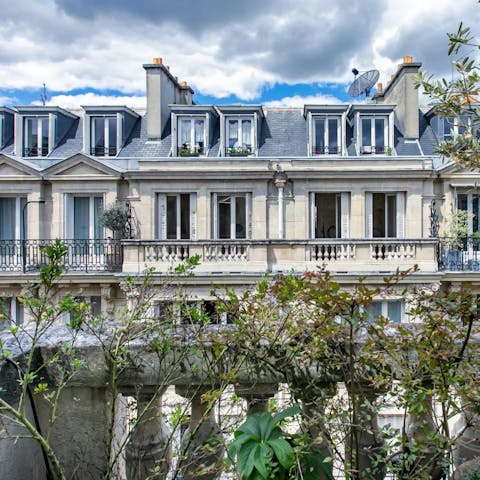 Admire the Parisian architecture from the private balcony