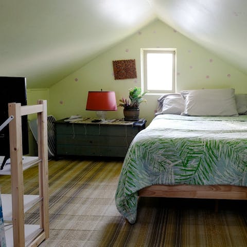 Retire to the cosy vaulted bedroom
