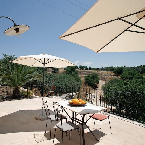 Dine alfresco on your private sun-drenched terrace, surrounded by countryside